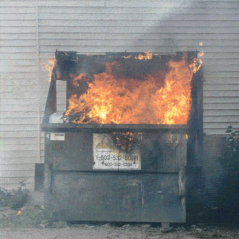 photo of a dumpster on fire